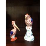 A Herend porcelain pelican and a Herend parrot. (Dimensions: Tallest 11cm.)(Tallest 11cm.)