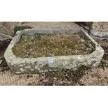 A stone sink of D section with flat back and rounded front corners. (Dimensions: 97 x 63 x 17cm)(