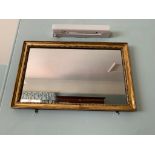 A giltwood framed rectangular wall mirror. (Dimensions: 55.5cm x 35cm)(55.5cm x 35cm)