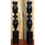 A pair of turned treen candlesticks. (Dimensions: Height 26cm)(Height 26cm)