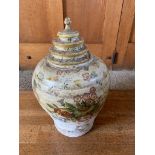 A floral painted terracotta urn, with associated wooden cover. (Dimensions: Height 43cm.)(Height