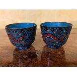 A small pair of Chinese cloissonne bowls, each decorated with stylised dragons. (Dimensions: