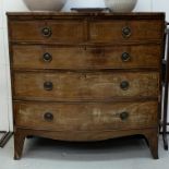 A Regency mahogany chest of drawers, with two short and three long drawers, on splayed bracket feet.