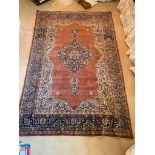 A Tabriz rug, North West Persia, the madder field with an indigo lobed pole medallion, within an