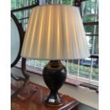 A black Japanned table lamp. (Dimensions: Height 36cm)(Height 36cm)