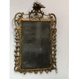 A giltwood pier glass, early 18th century. (Dimensions: 115cm x 71cm)(115cm x 71cm)