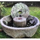 A magnificent Cornish granite cider press with its rolling stone.