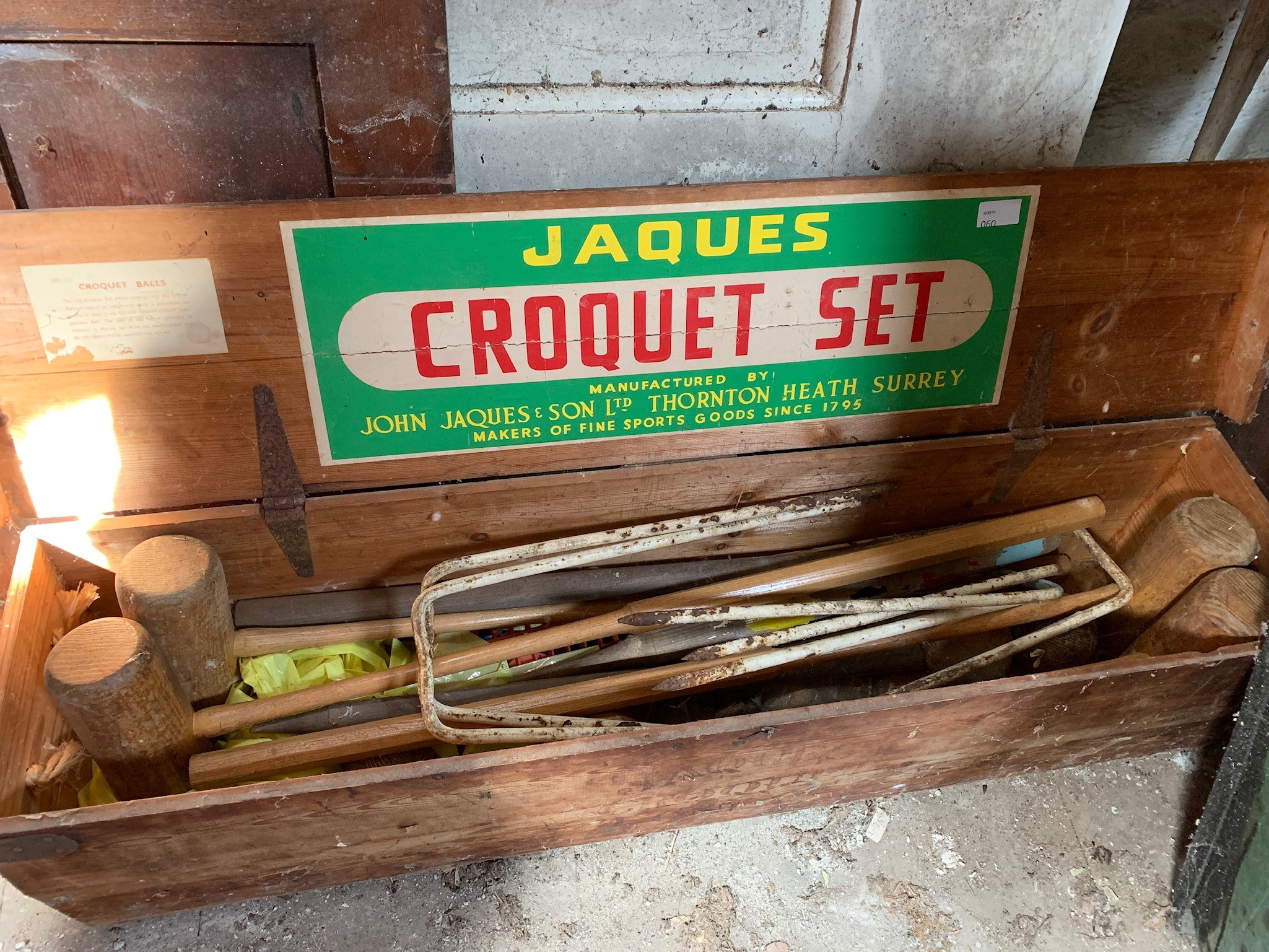 A Jaques croquet box and contents.