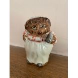 A Beswick figure 'Miss Tiggywinkle'. (Dimensions: Height 8cm)(Height 8cm)