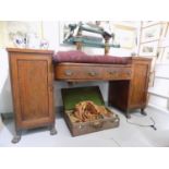 A mahogany pedestal sideboard, early 19th century, with a pair of central drawers flanked by