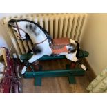 A 20th century carved wood rocking horse. (Dimensions: Height 95cm)(Height 95cm)