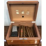 A J Fox & Sons London humidor with contents of assorted cigars. (Dimensions: Height 12cm, width 22.
