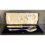 A pair of art nouveau silver plated cake servers, cased.