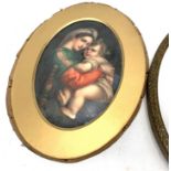 A continental oval porcelain plaque enamelled after "The Madonna della Sedia" by Raphael. Gilt