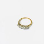 An 18ct gold ring set four diamonds.