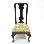 A George II walnut single dining chair, with a solid vase shaped splat and drop in seat, on cabriole
