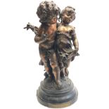 A spelter group of a boy and girl, 19th century, signed Auguste Morsay, with brass plaque