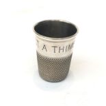 A Charles Horner silver shot cup in the form of a thimble engraved 'Just A Thimbleful', Chester