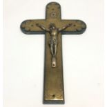 An early 20th century brass and spelter crucifix, mounted on wooden cross. (Dimensions: Height