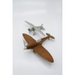 A chrome aeroplane and together with a treen and chrome model of a spitfire (2). (Dimensions: Length