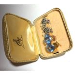 A pair of 9ct gold clip on earrings set blue glass and another pair set marcasite and pearls,