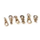 4 x 9ct gold swivel clips, 7.1gm together with two others unmarked.