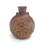 A red ware bottle with museum label inscribed 'BOTTLE IN REDWARE', with two loops for suspension.