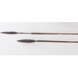 Two African tribal spears, each with part leather covered wooden handles. (Dimensions: Lengths 143