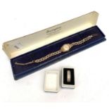 A Renown 9ct gold ladies wristwatch on gold strap together with a silver ring.