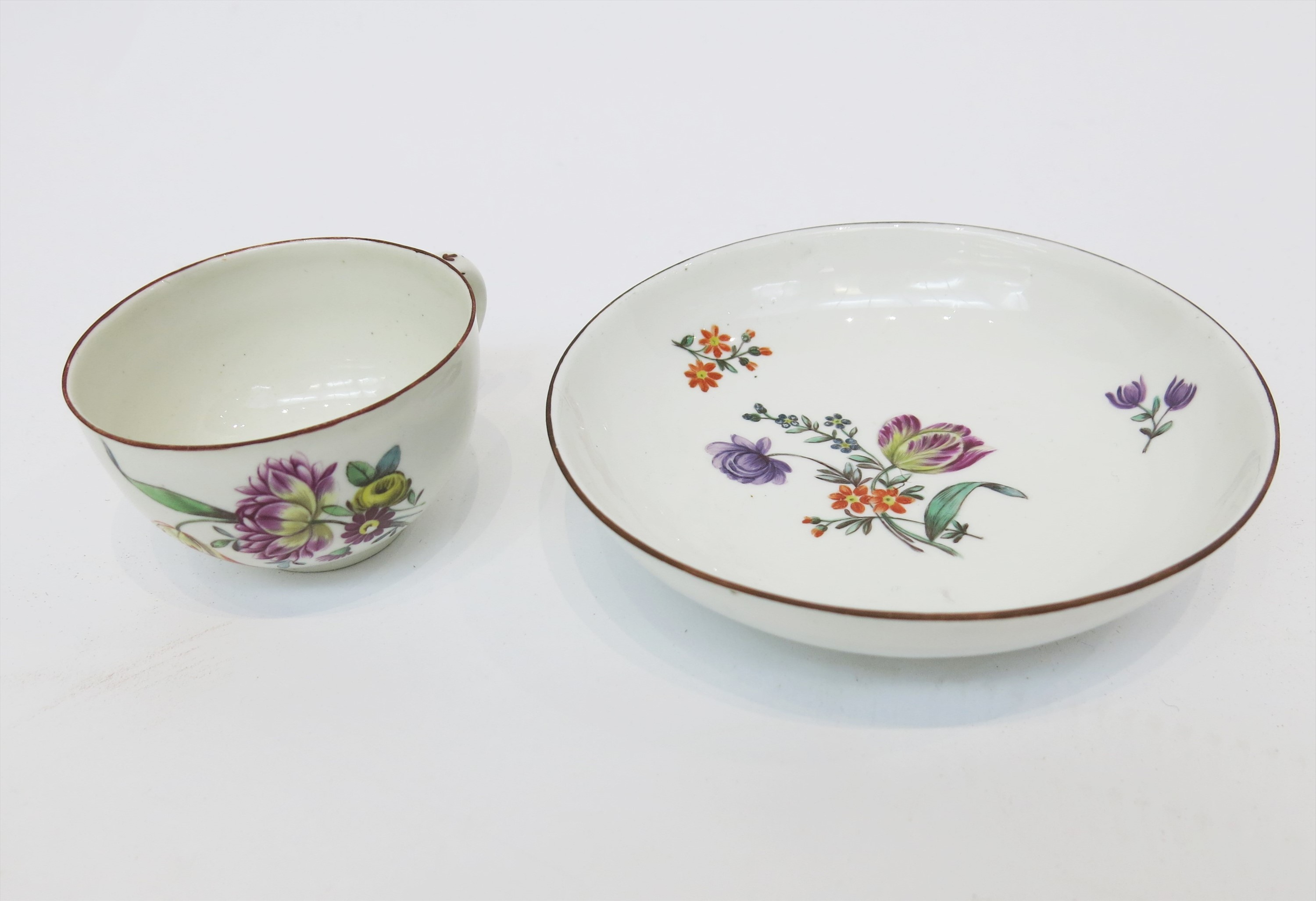 An 18th century Frankenthal teacup and saucer painted with floral sprays.Condition report: See - Image 2 of 11