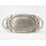 An Arts and Crafts period pewter and copper tray, impressed to reverse REGD T.M NO. 392921. (