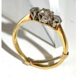 An 18ct gold ring set three diamonds.