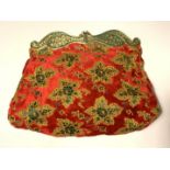 Fine evening clutch purse of deep red velvet cut with leaf motifs in gold and green. Elaborate