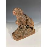 A late 19th/early 20th century Black Forest type carving of a St. Bernard dog. (Dimensions: Height