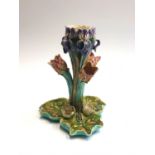 A French majolica centrepiece, moulded with irises, tulips and waterlilies. (Dimensions: Height
