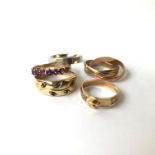 A 9ct gold three colour triple ring and four other gold rings.