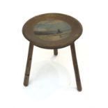 A wood stool on ring turned legs, the dished top painted with a view of St. Michael's Mount. (