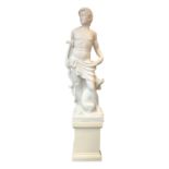 A composite marble style statue of a hunter with a dog, on plinth. (Dimensions: Height of figure