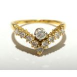 An 18ct gold wishbone ring set with diamonds.