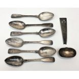 A set of six Georgian silver fiddle pattern dessert spoons together with a damaged Arts and Crafts