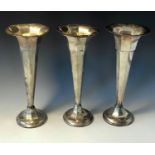 Three silver vases