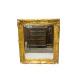A gilt composition rectangular wall mirror, 19th century. (Dimensions: Height 78cm, width 67cm.)(