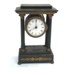 A French late 19th century bronze and gilt portico mantel timepiece, of diminutive proportions,