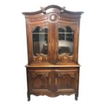 A French carved pine buffet a deux corps, circa 1800. (Dimensions: Height 226cm, width 135cm.)(