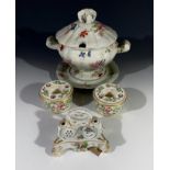 A pair of Derby inkwells with polychrome floral decoration, circa 1863-66, height 4cm, together with