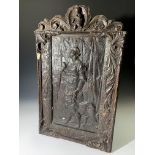 A mid Victorian relief moulded plaster panel,depicting a lady with a dog and a parrot, within a