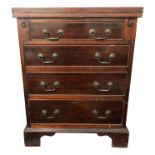 A George III style mahogany batchelors chest, the fold over hinged top above four long drawers on
