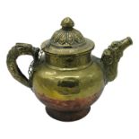 A Tibetan brass and copper large teapot, 19th century, with dragon handle and dog of foe spout. (