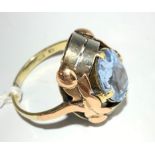 An aquamarine and gold ring.