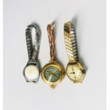 A lady's 15ct gold cased wristwatch on expanding 9ct gold bracelet. Together with tow other ladies